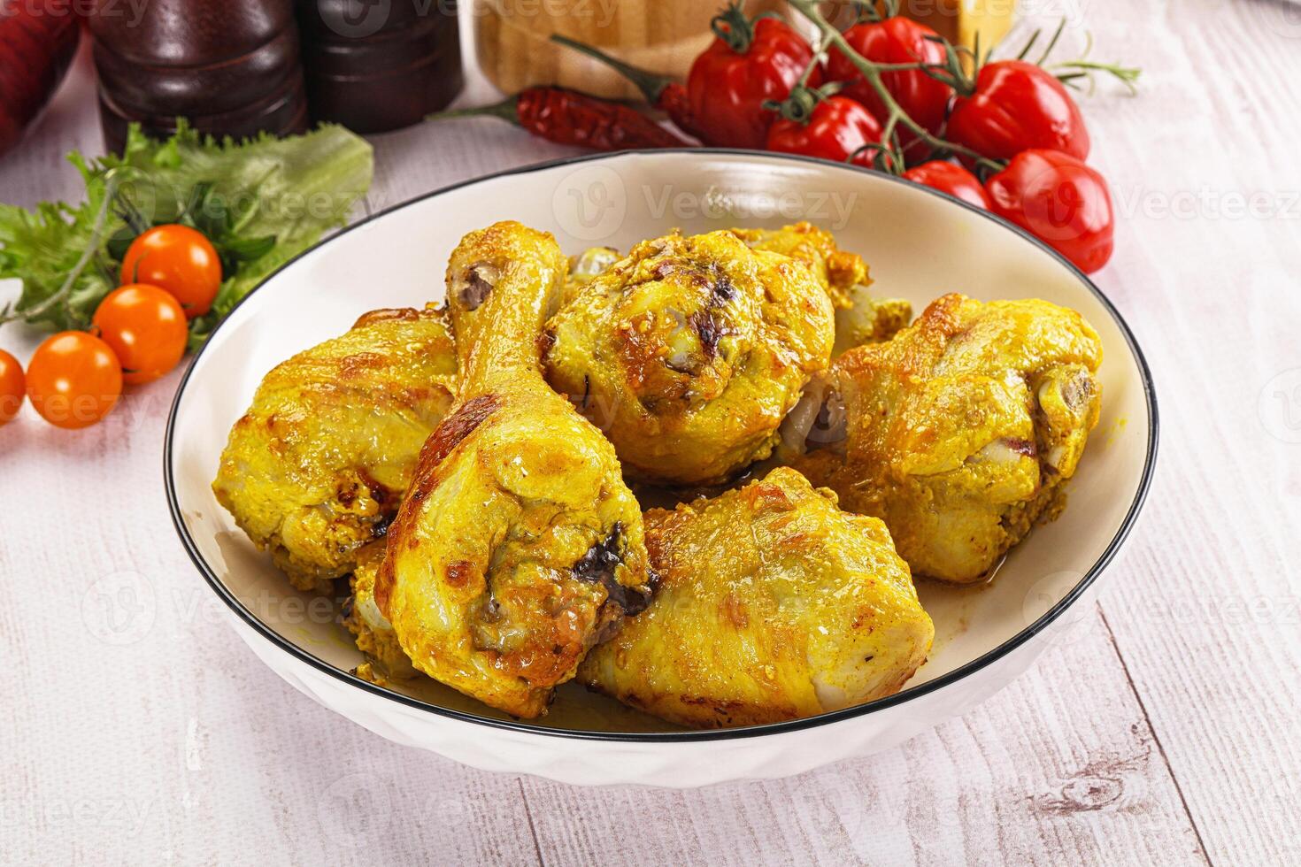A bowl of chicken on a table photo