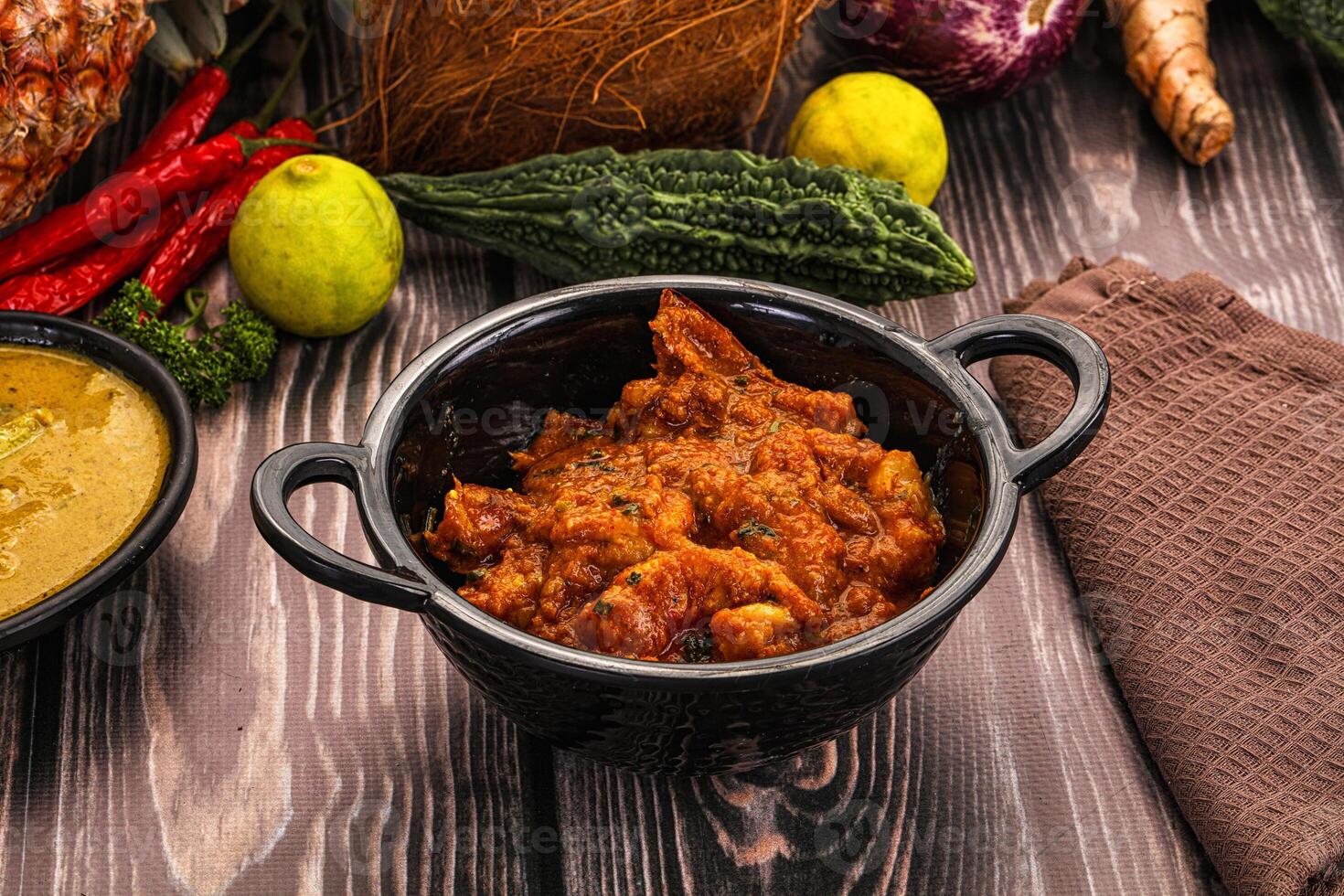 A table with a bowl of food and other items photo
