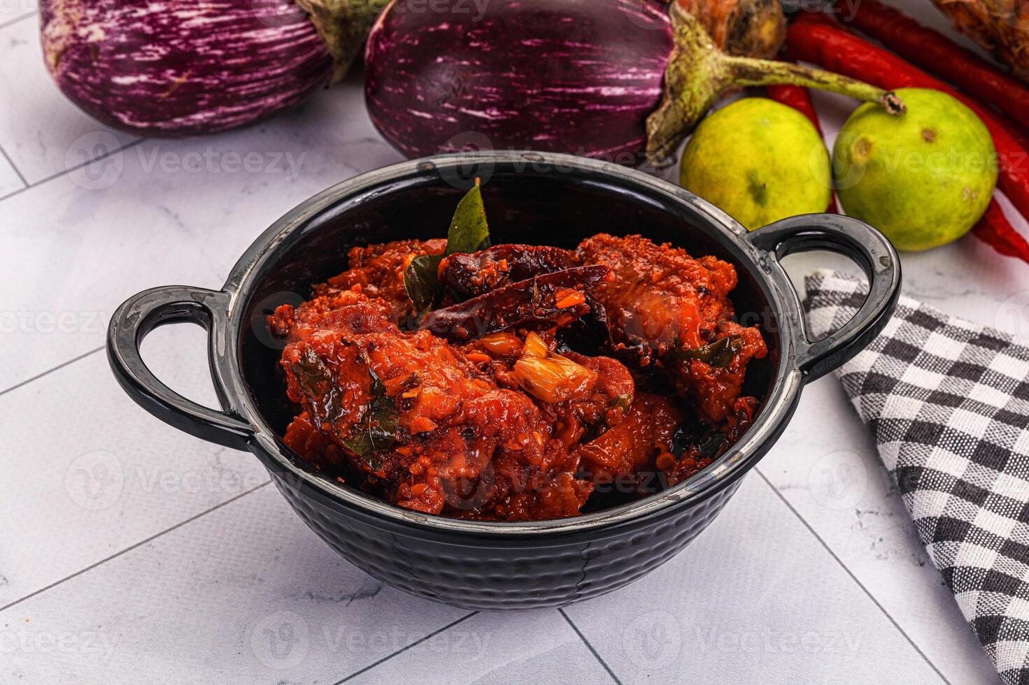 A bowl of food with vegetables and spices photo