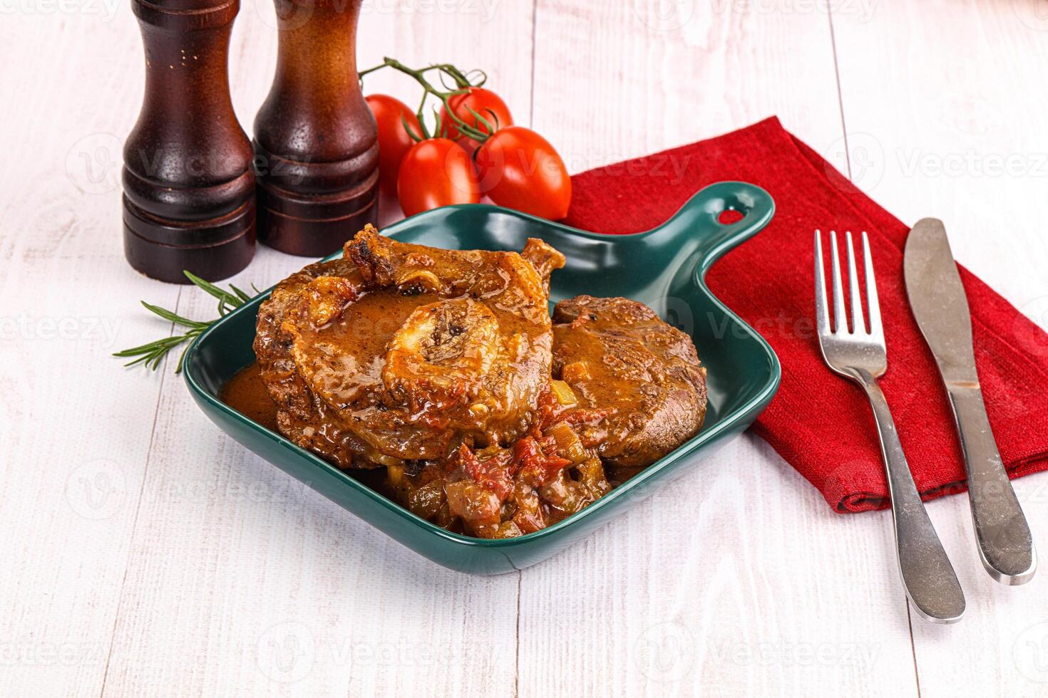 A plate of food with a fork and knife photo