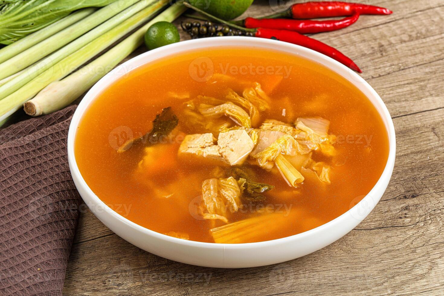 A bowl of soup with vegetables and other ingredients photo
