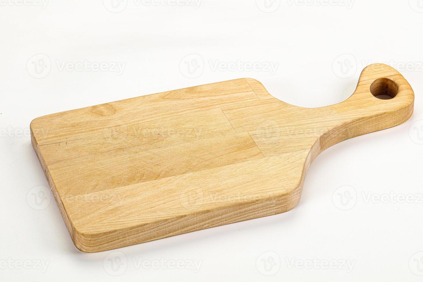 A wooden cutting board with a handle photo