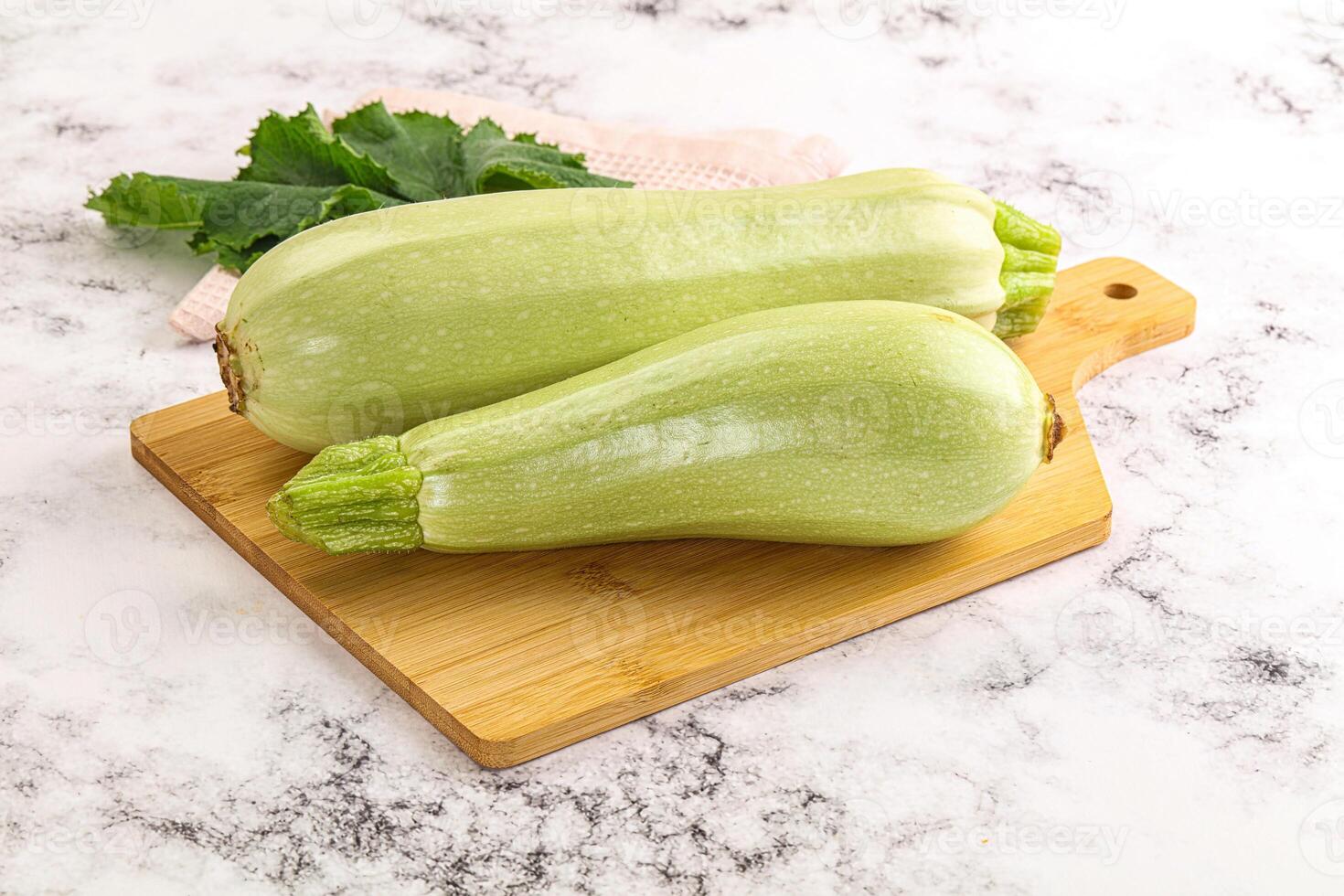 Two zucchini on a cutting board photo
