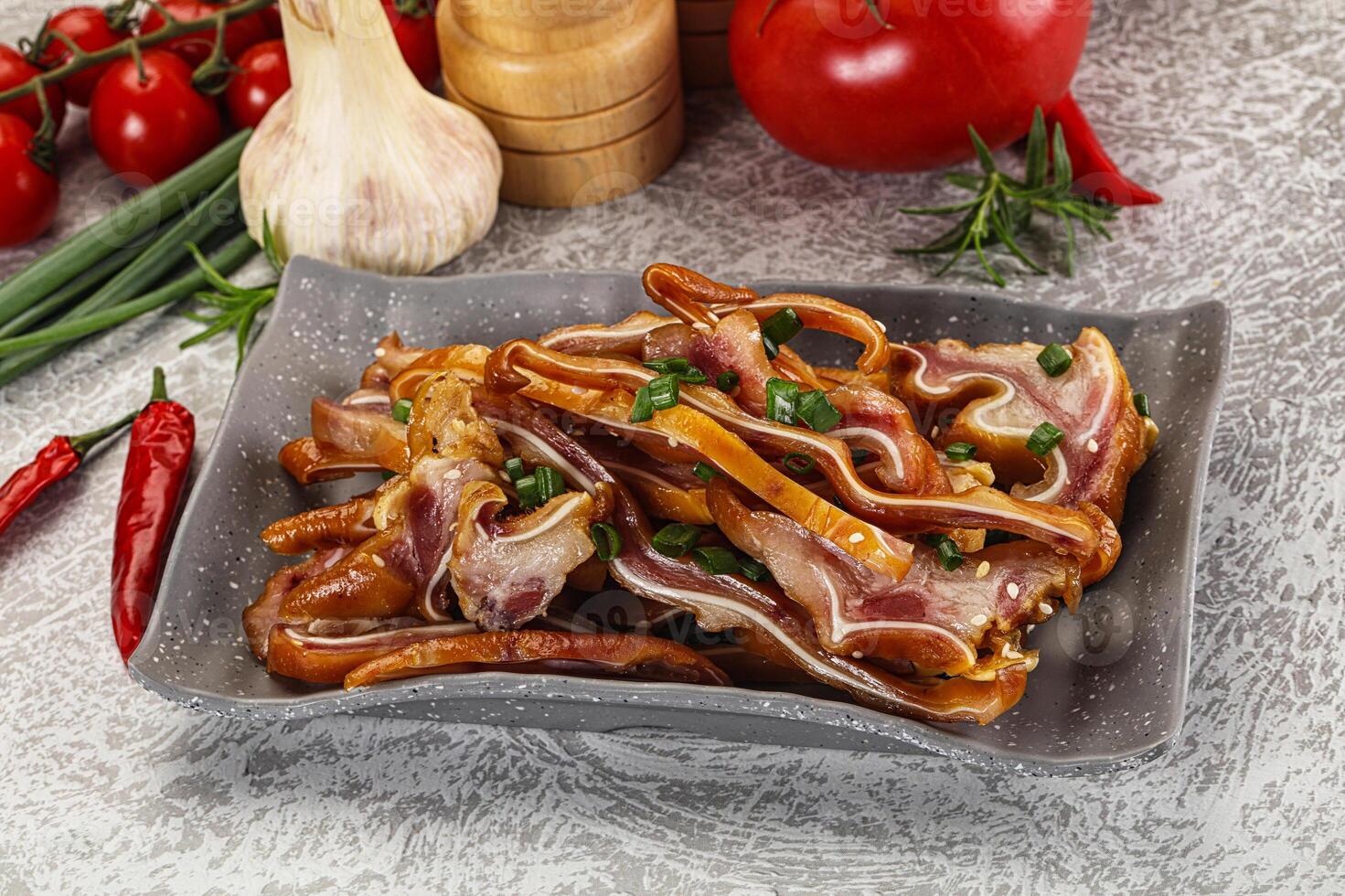 A plate of bacon and vegetables on a table photo