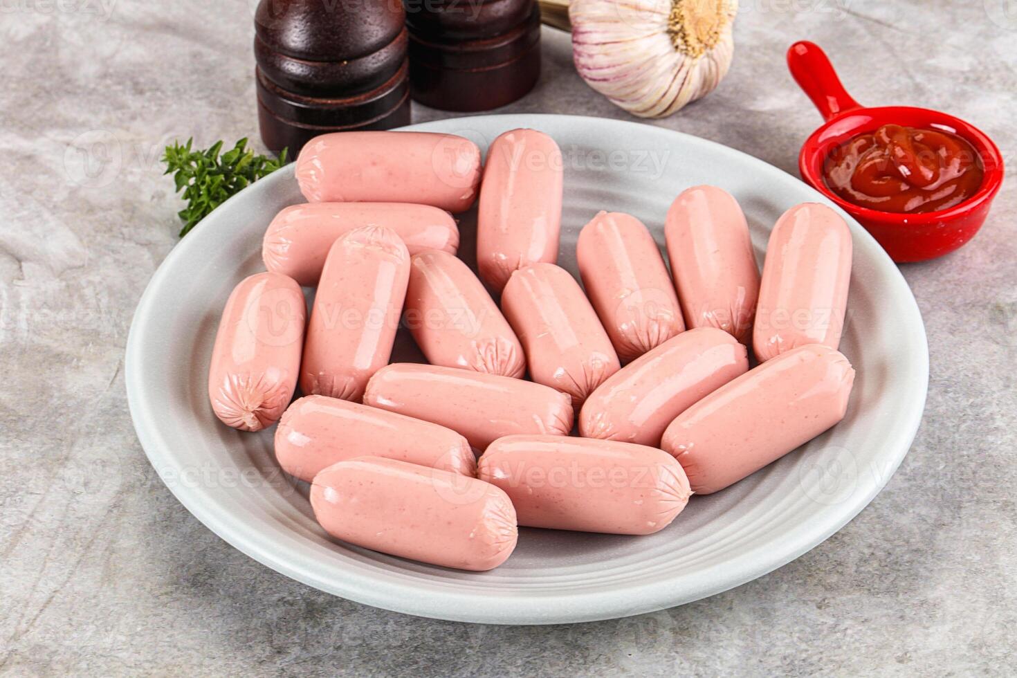 A plate of sausages on a counter photo