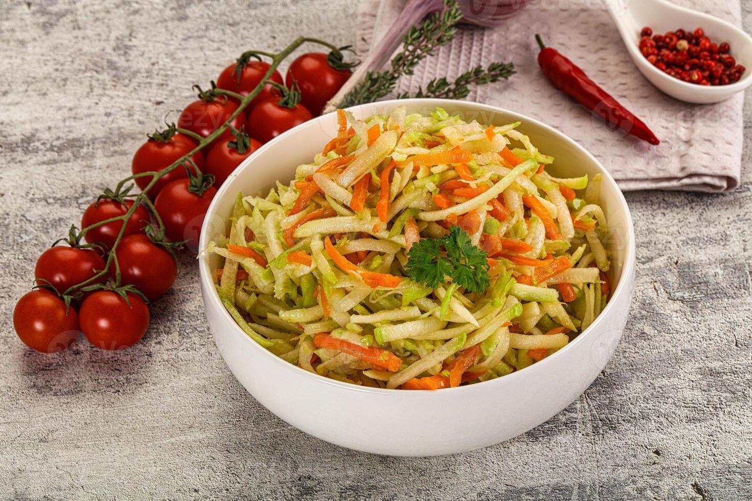 A bowl of salad with carrots and tomatoes photo