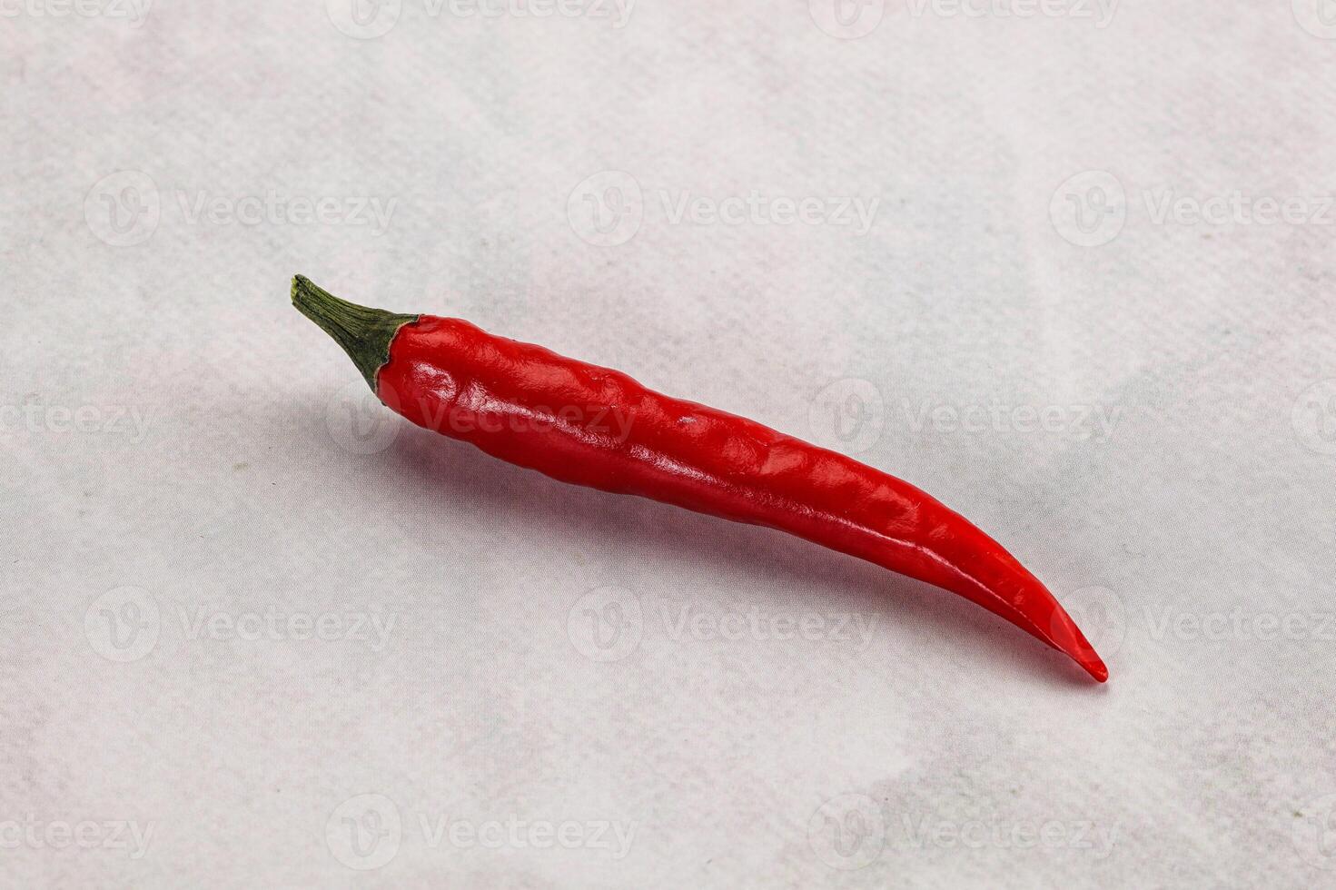 A red chili pepper on a white background photo
