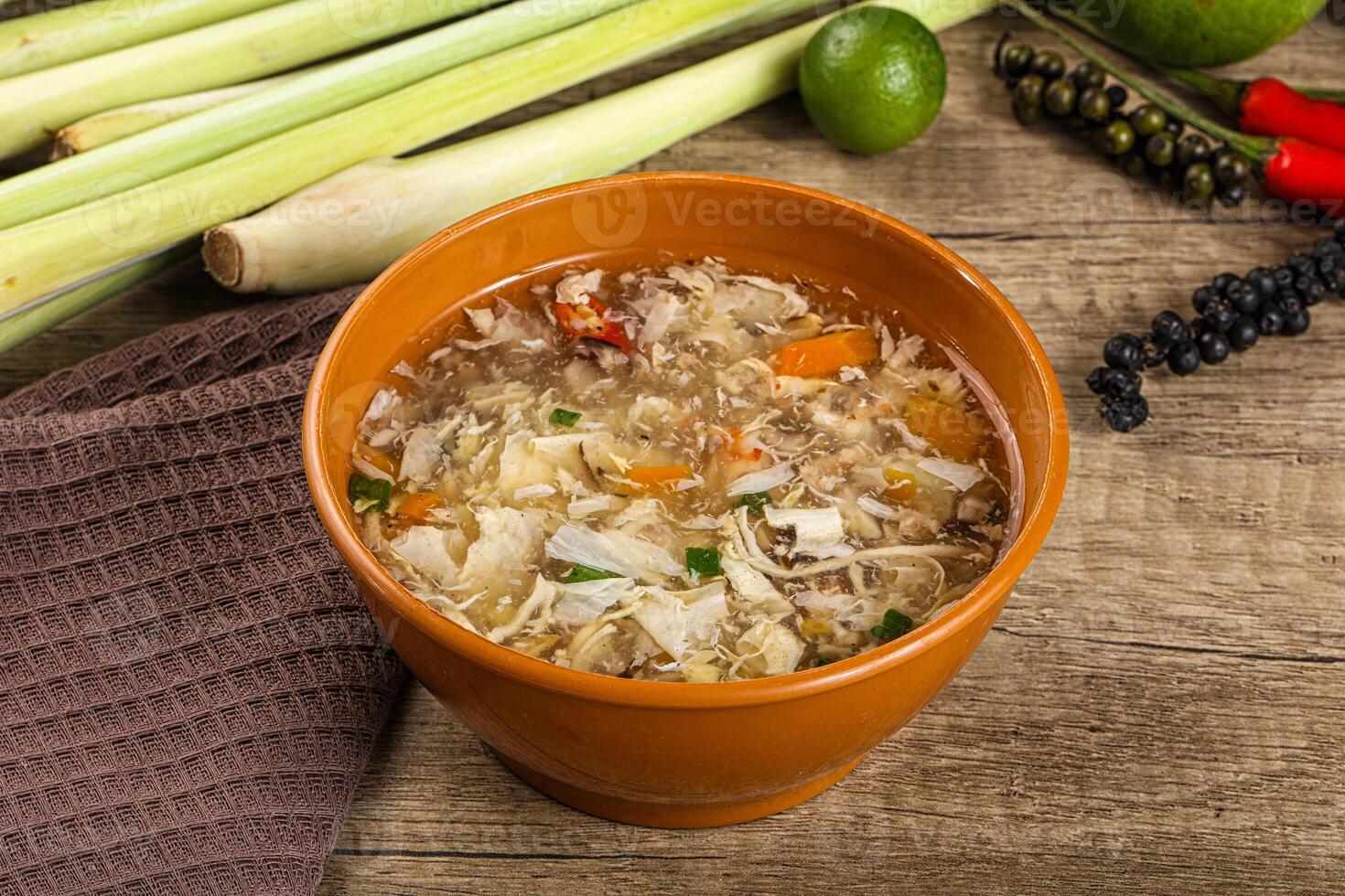 A bowl of soup with vegetables and other ingredients photo