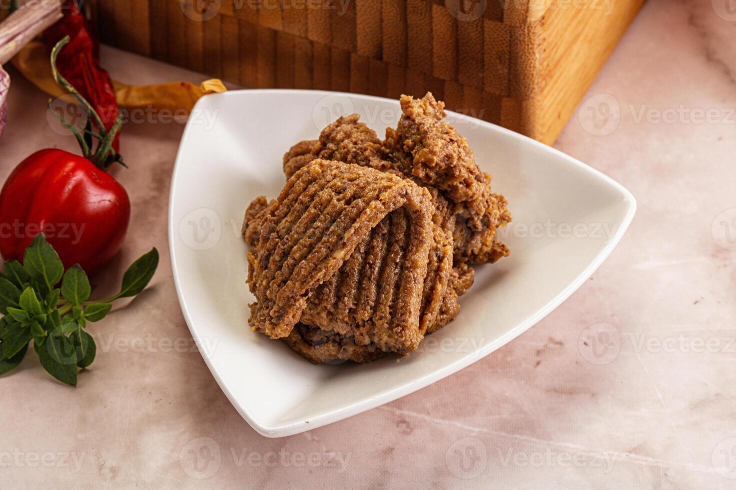 A plate of food with a wooden basket next to it photo