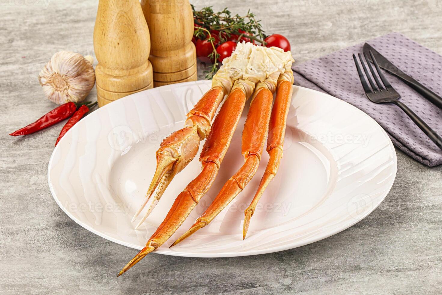 A white plate with a crab on it photo