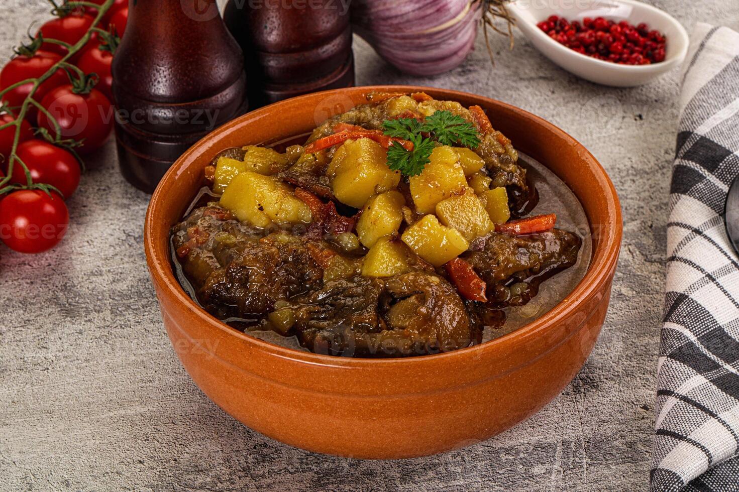 A bowl of stew with vegetables and potatoes photo