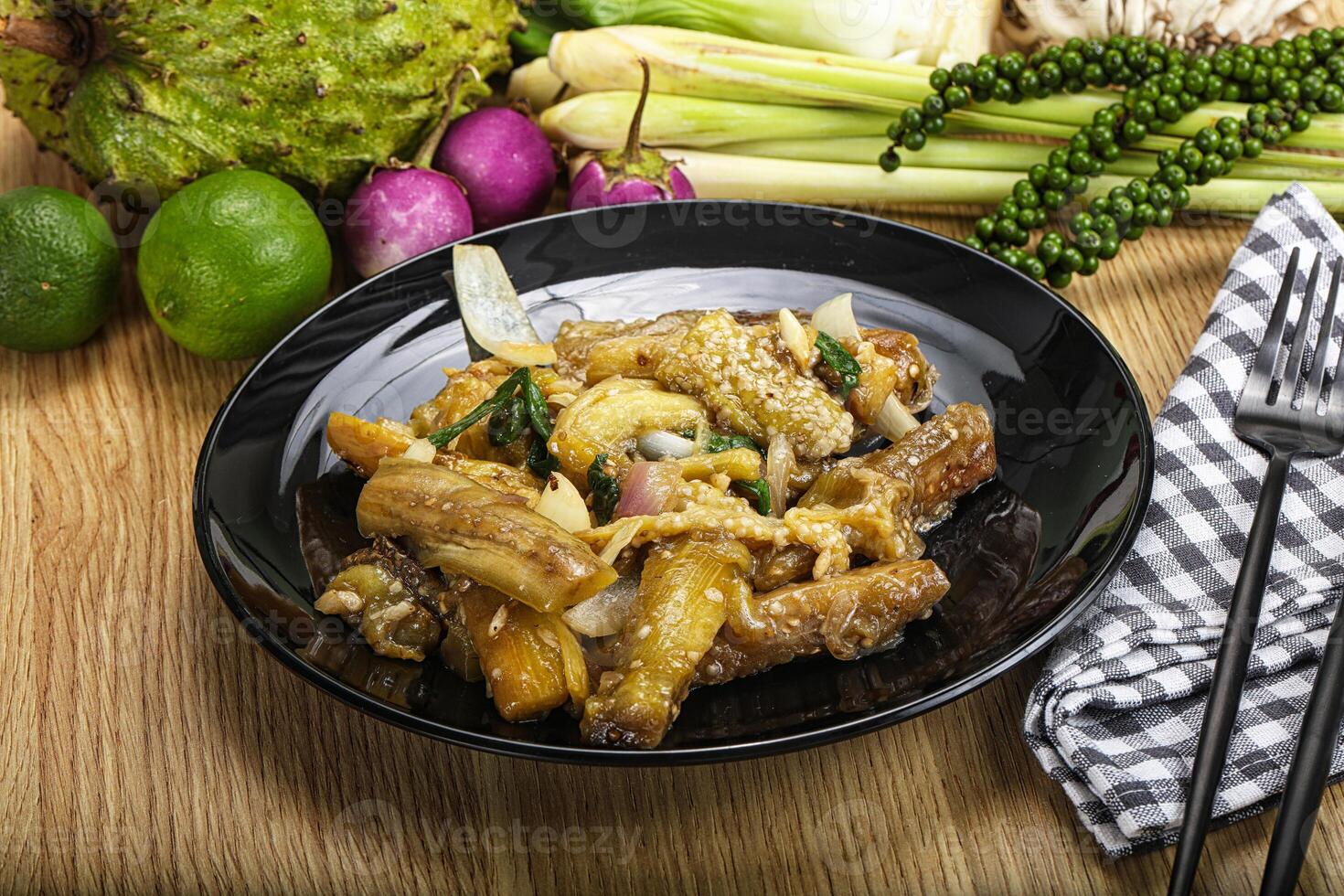 A plate of food with vegetables and a fork photo