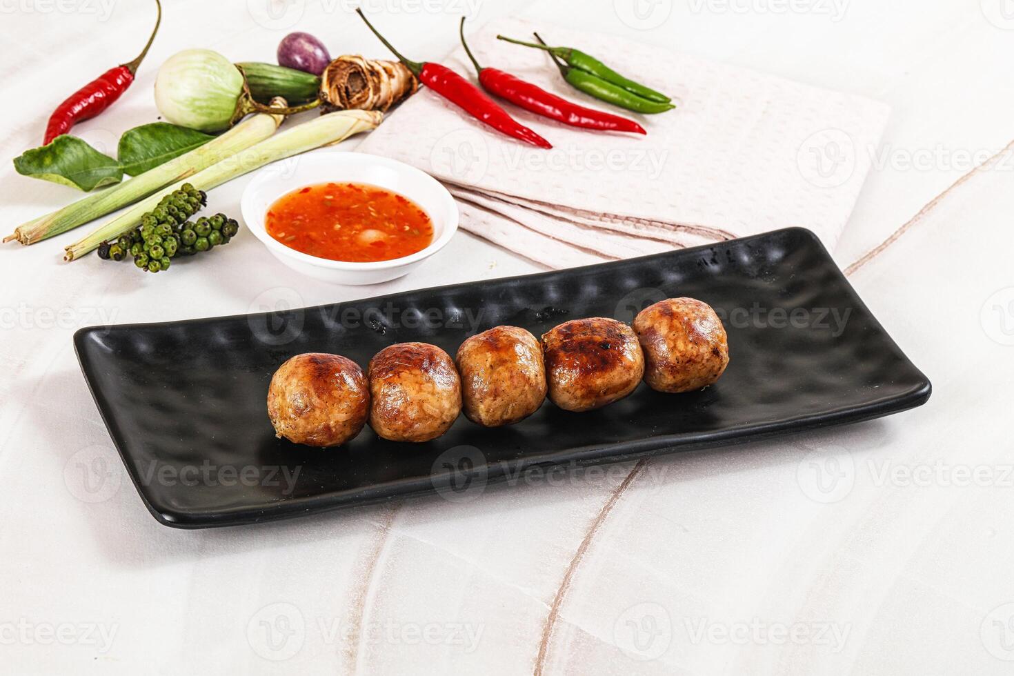 A black rectangular plate with a bunch of meat on it photo