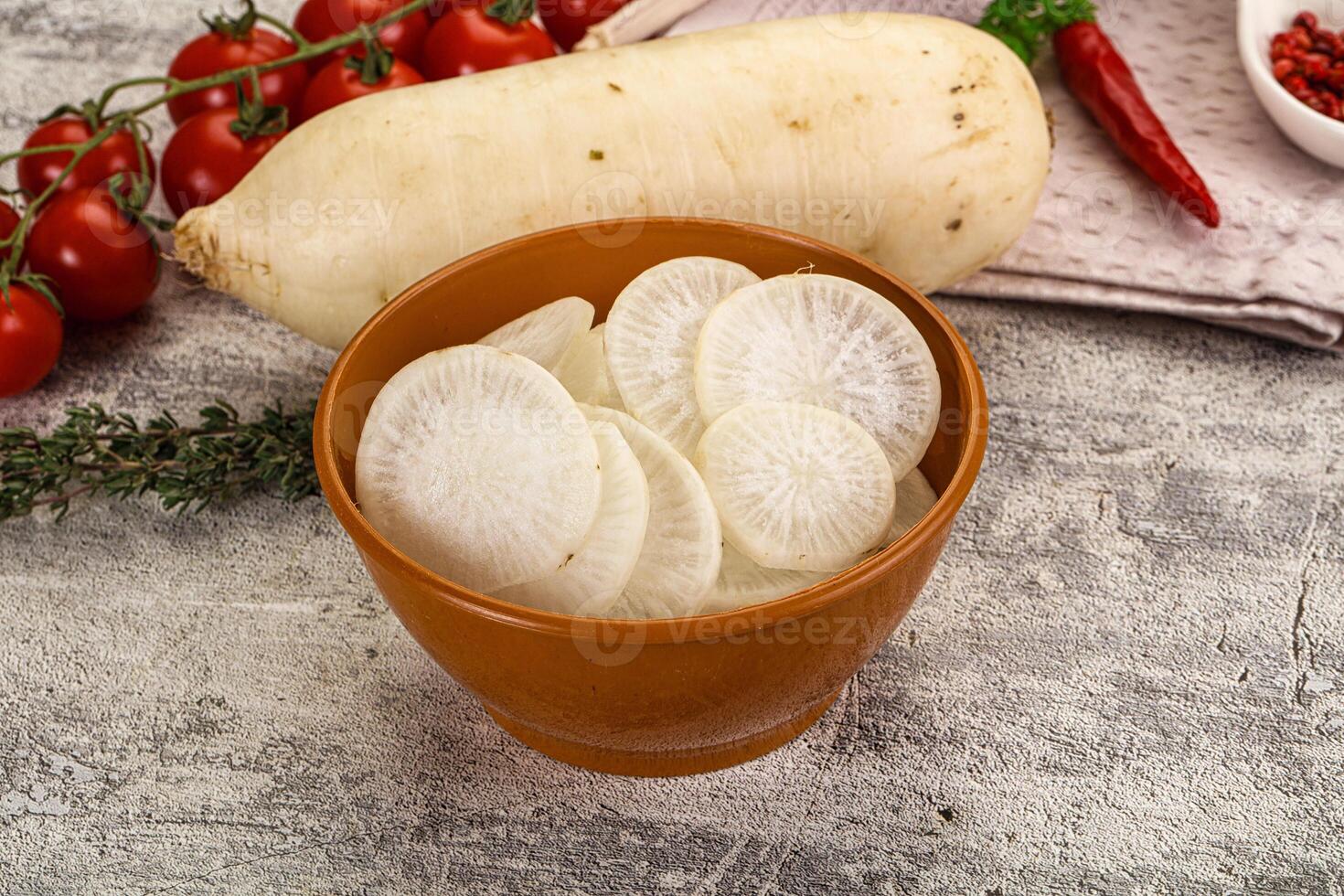 A bowl of white potatoes and vegetables on a table photo