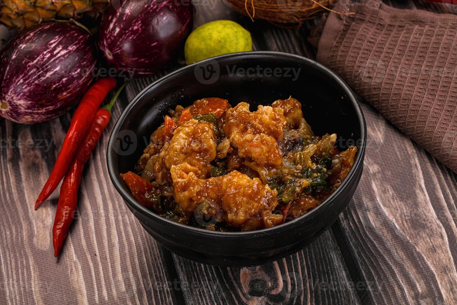 A bowl of food with vegetables and spices photo