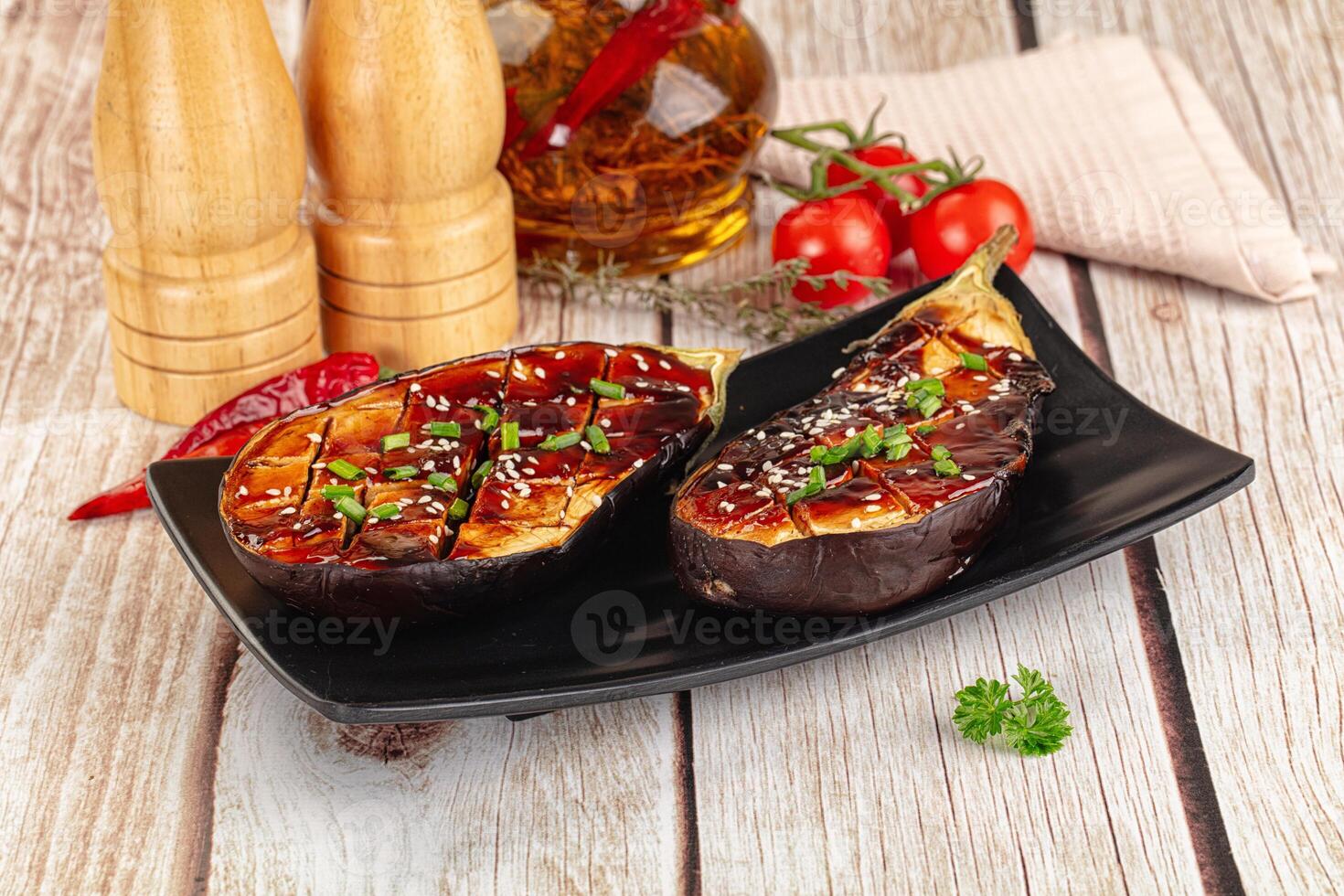 A plate with two eggplant steaks on it photo