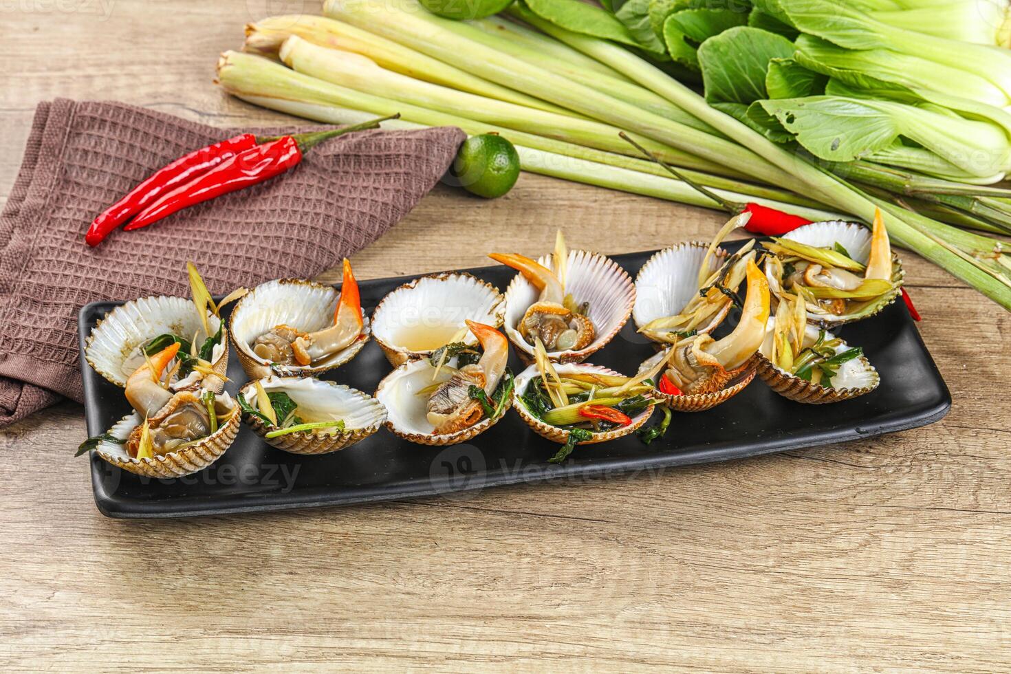 A black tray with a bunch of food on it photo