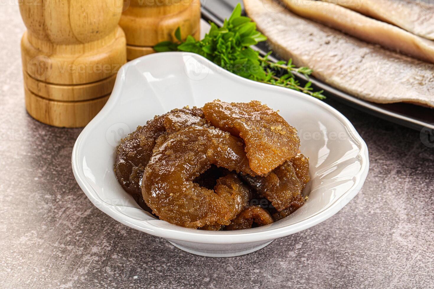 A bowl of food with some meat and spices photo