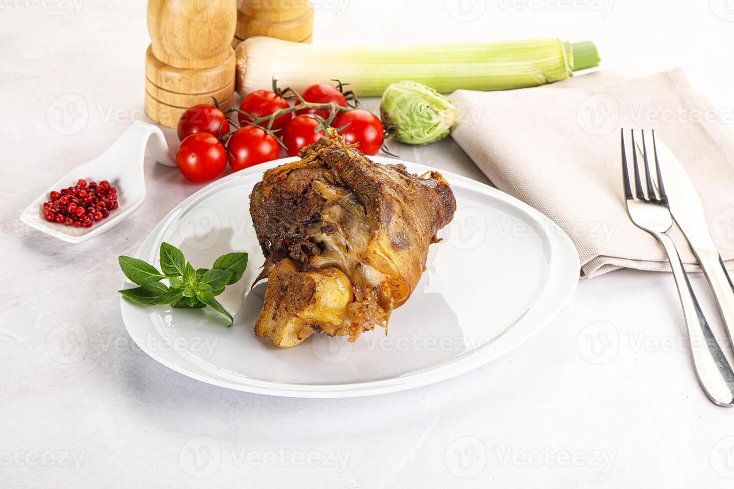 A plate with a piece of meat on it photo