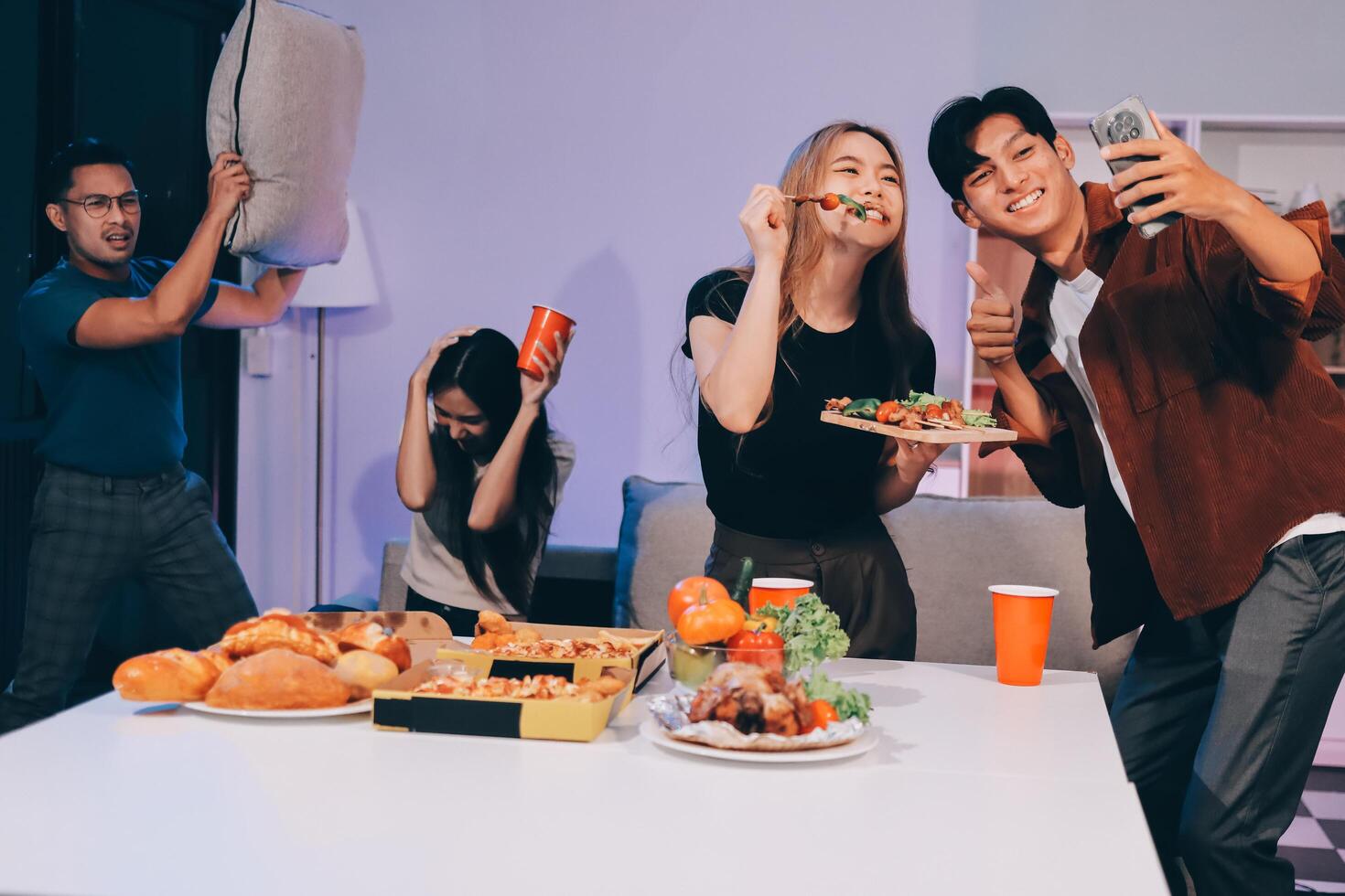 A group of people eating pizza and drinking beer photo