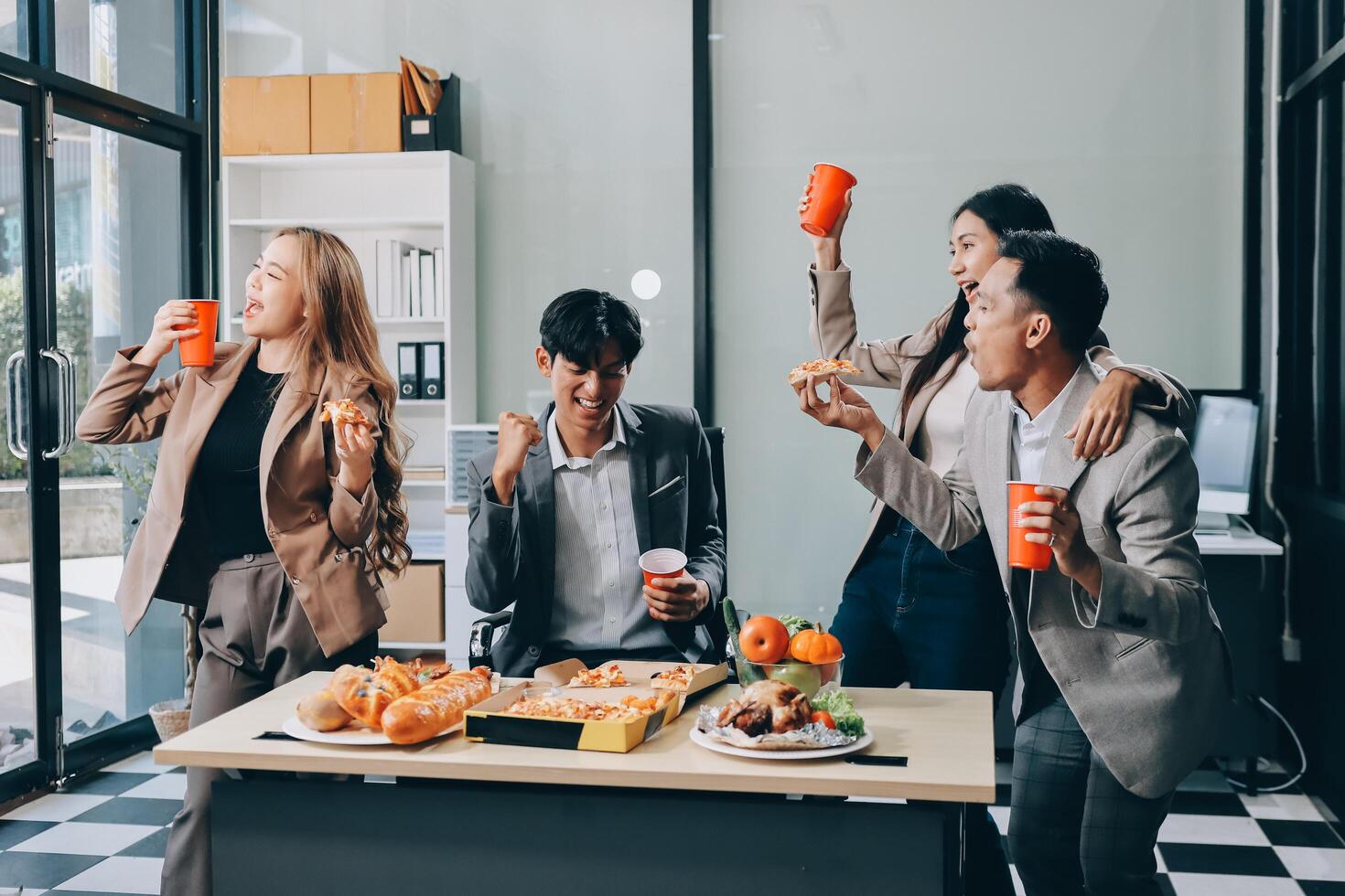 Business people eating food in office photo