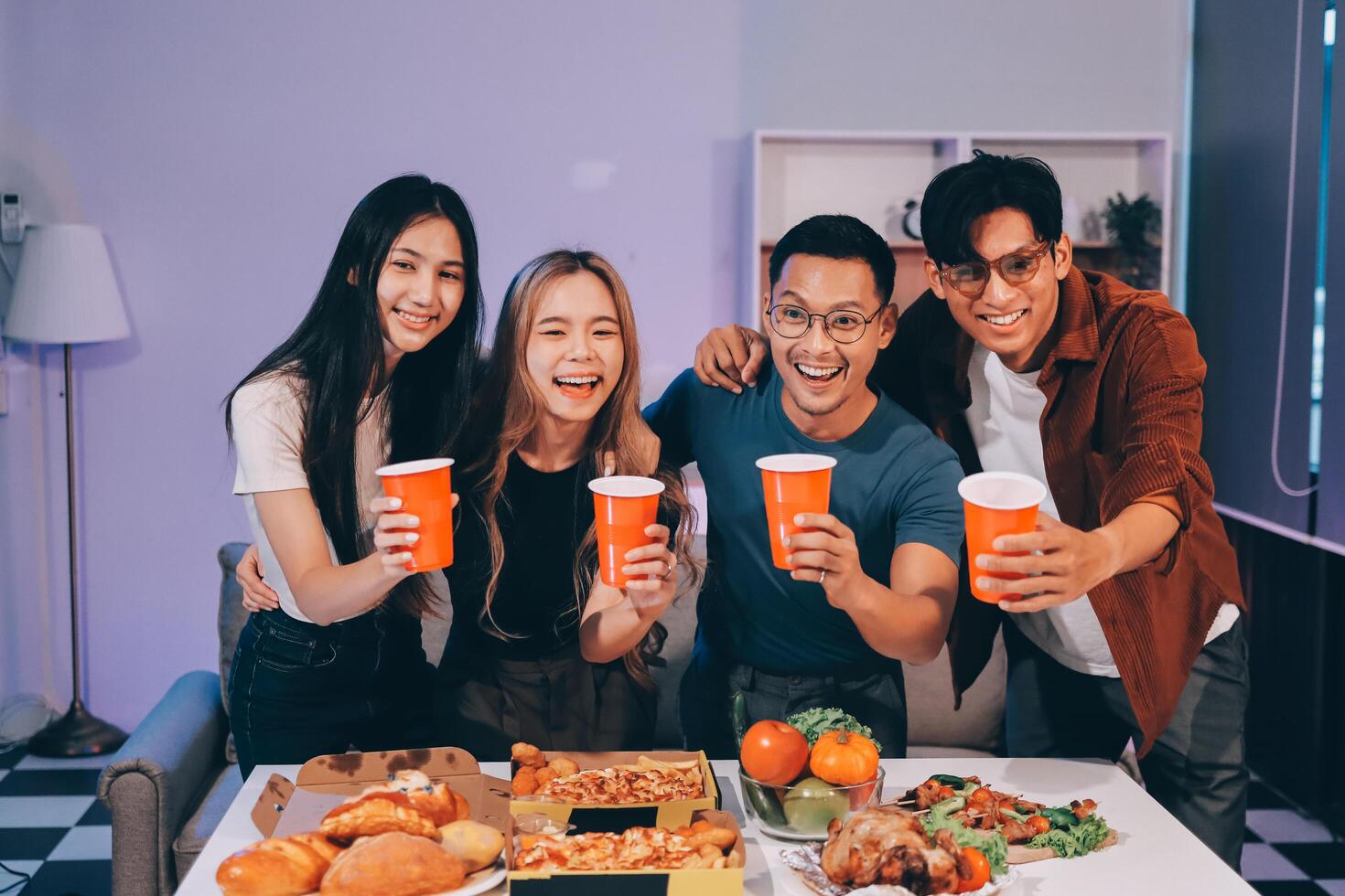 Four friends enjoying a meal together photo