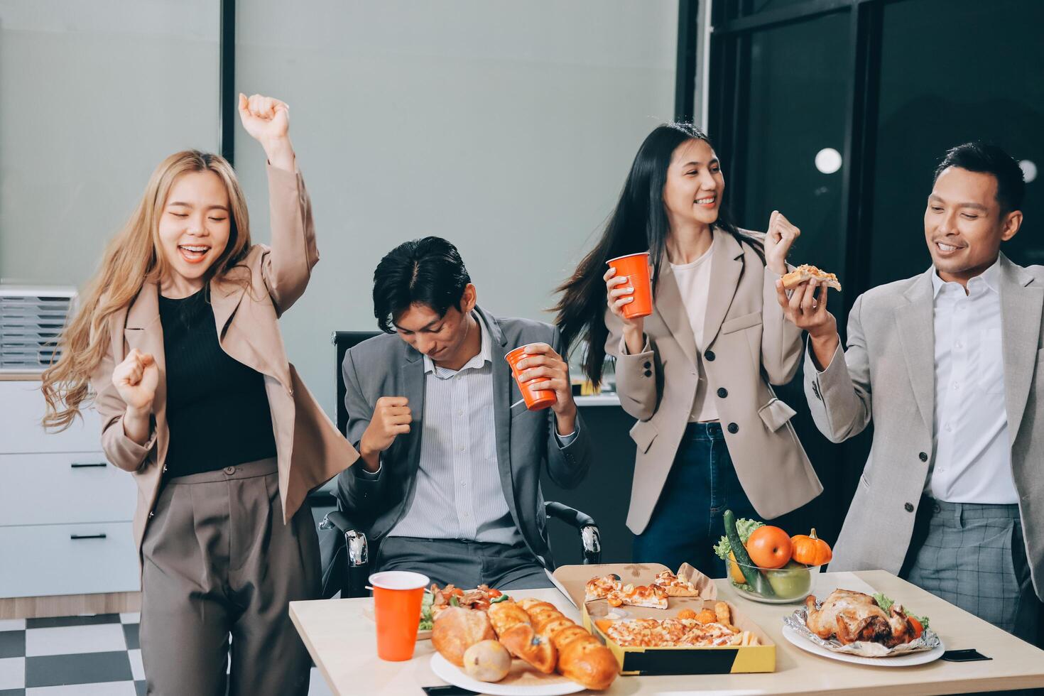 Group of business people celebrating at the office photo
