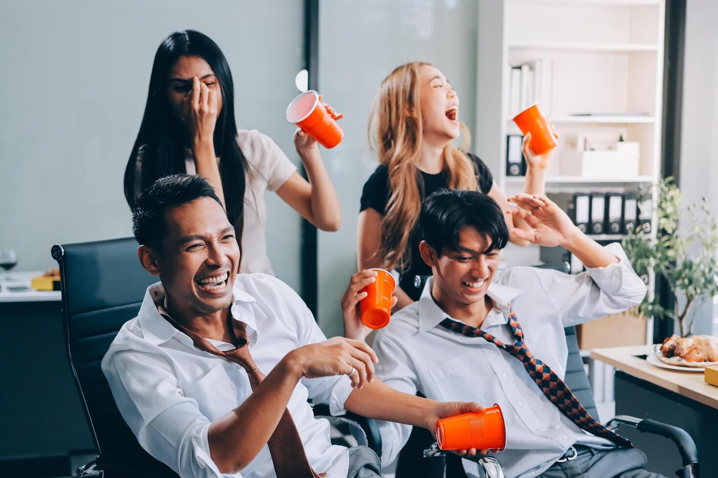 Group of young asian business people having fun in office photo