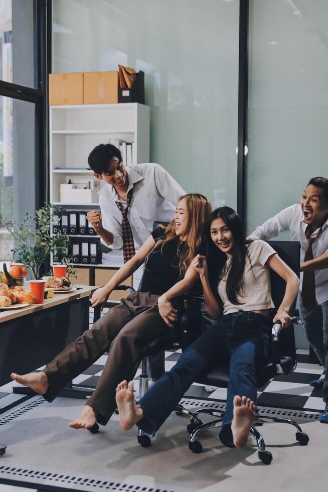 Group of people sitting on chairs in office photo