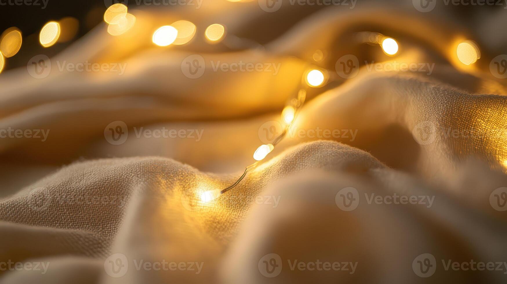 Soft, warm fabric illuminated by glowing fairy lights creates a cozy atmosphere for relaxation and comfort in a tranquil setting photo