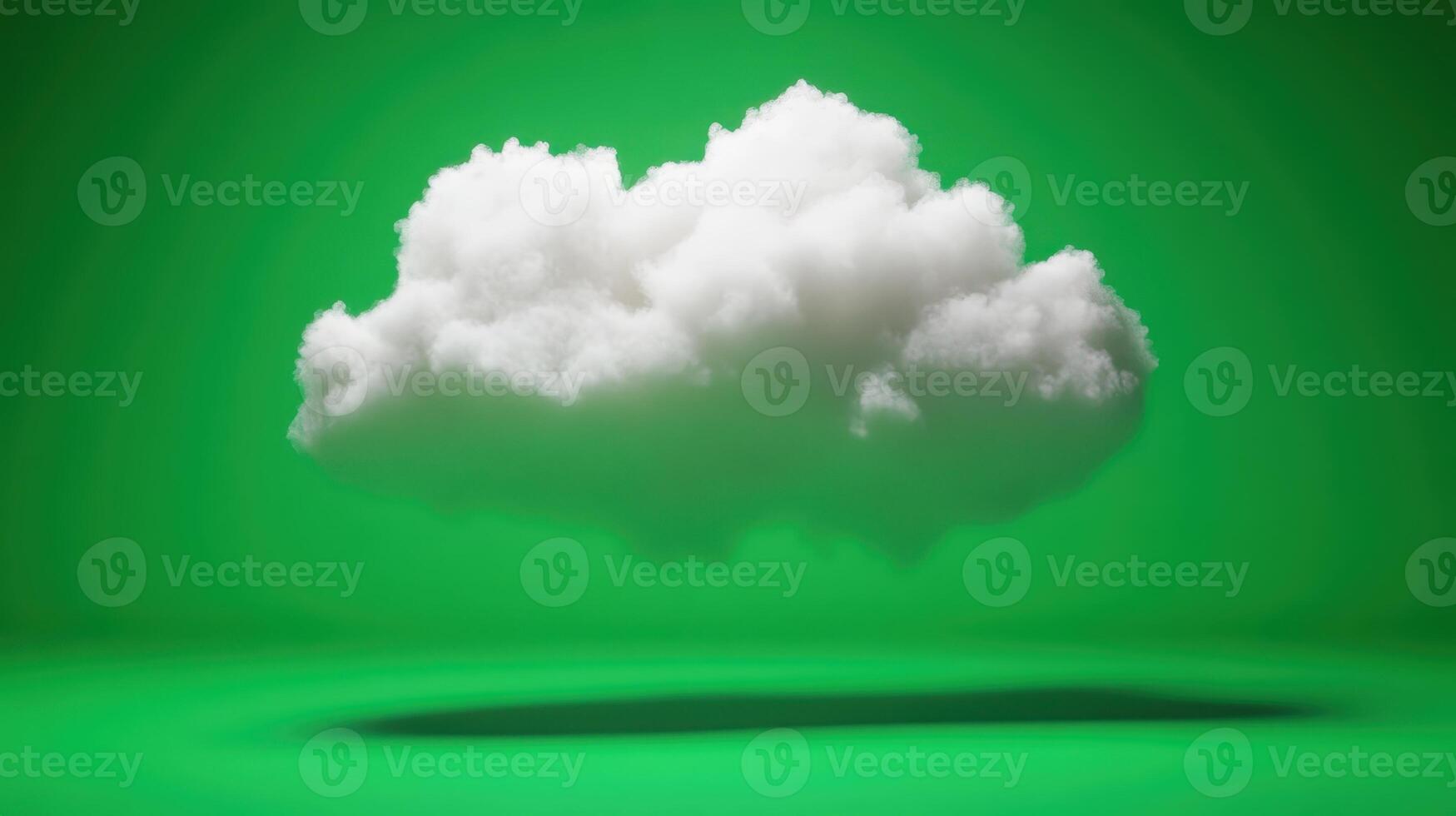 White cloud floating over a vivid green background creating a striking visual contrast with soft shadows on the surface below photo