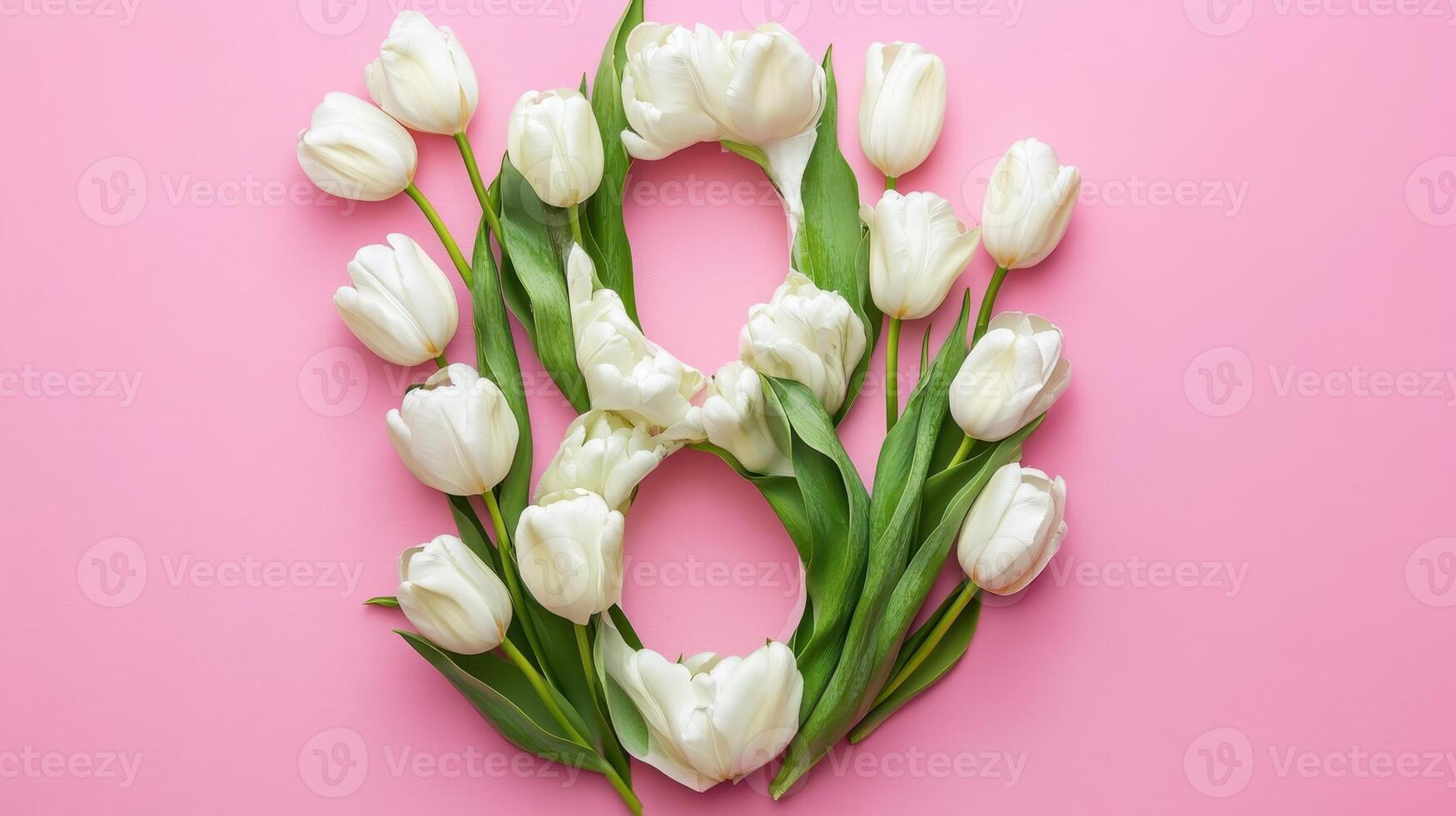 A beautiful decorative arrangement featuring delicate white tulips gracefully shaped into the number eight against a soft pink background photo