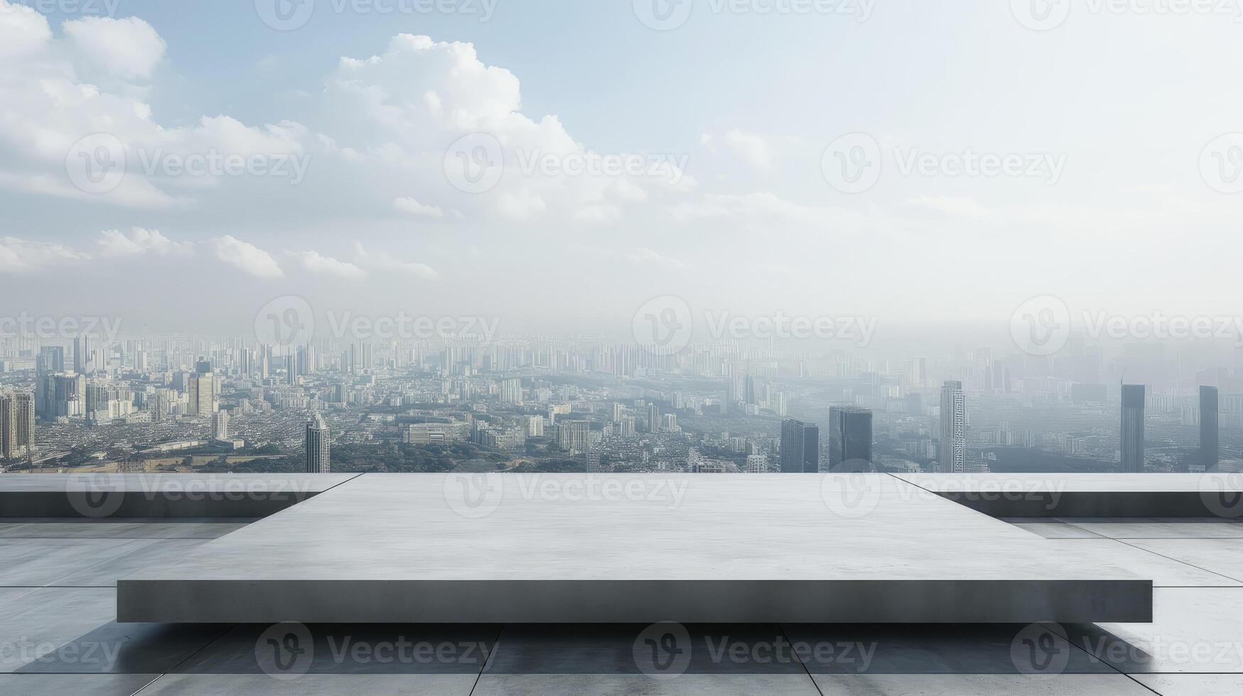 Empty concrete platform on a rooftop with cityscape in the background photo
