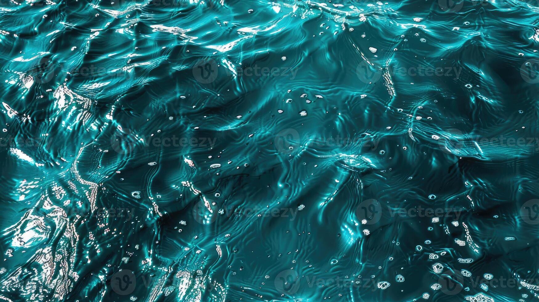 A close up of the ocean waves with some bubbles photo