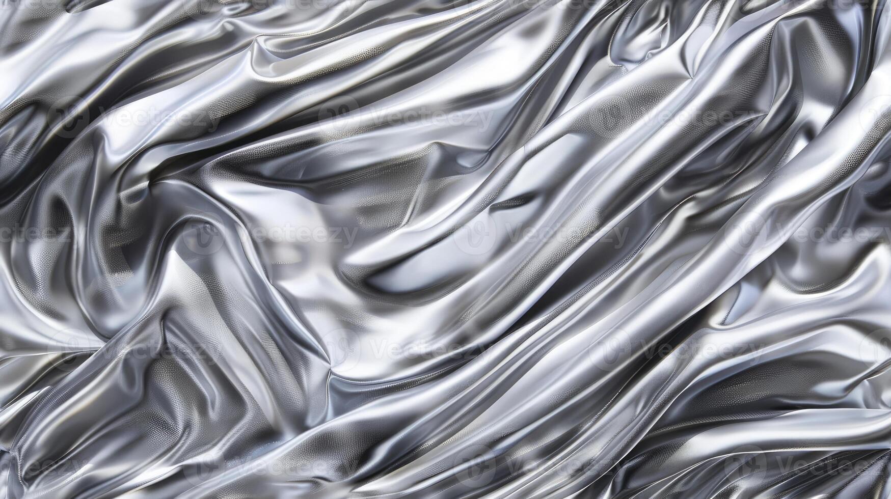 A silver metal surface with waves and swirls photo