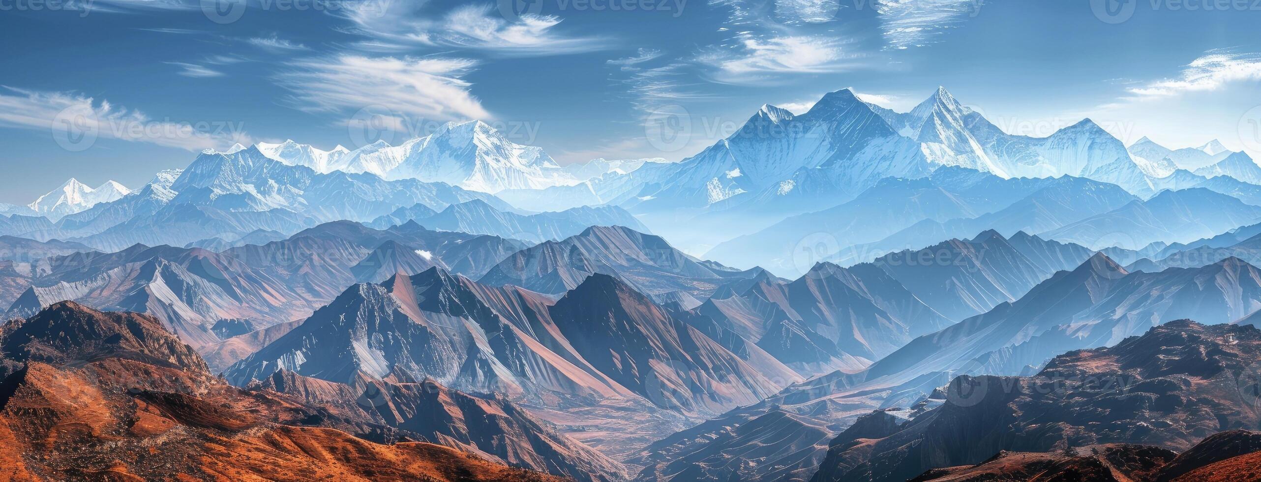 A mountain range with snow capped peaks photo