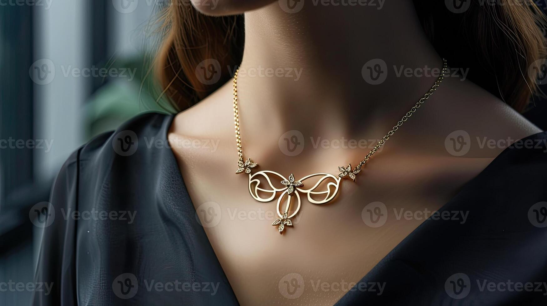 A woman wearing a gold necklace with a butterfly design photo