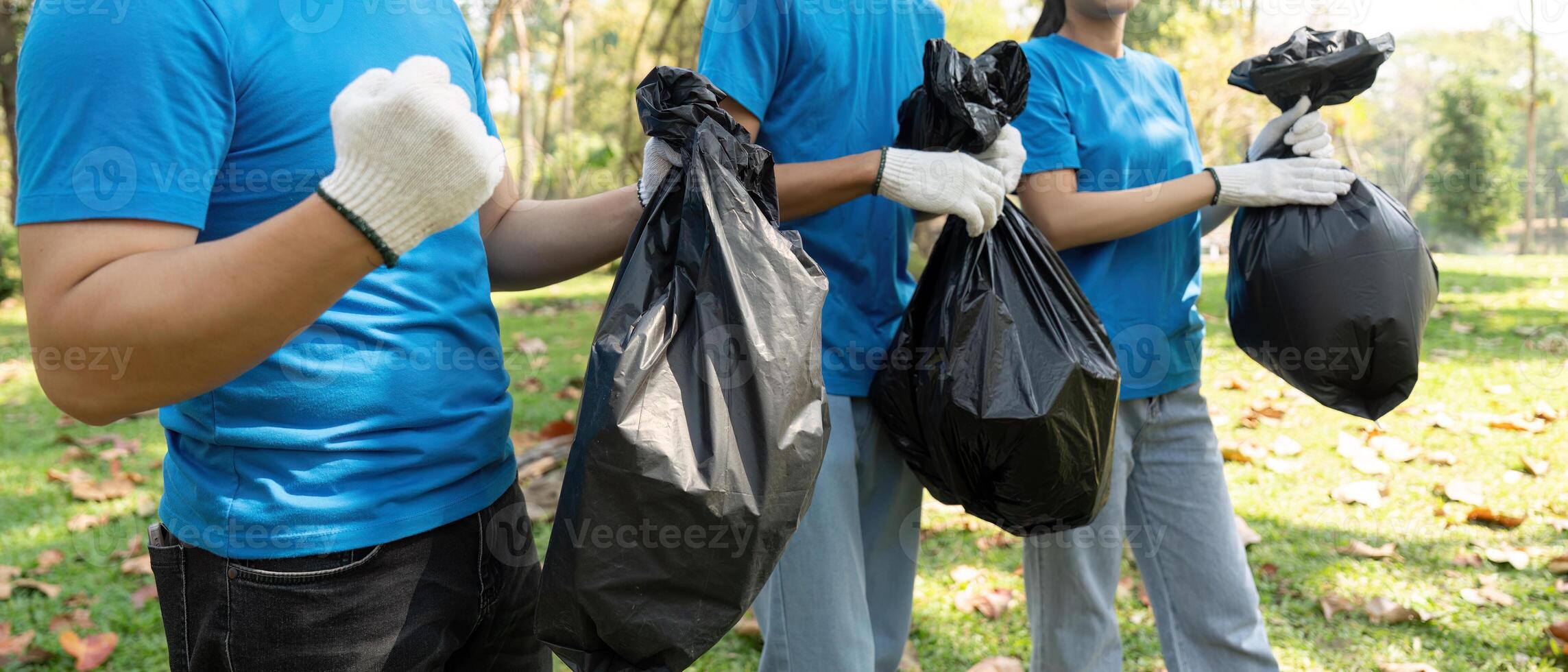 Community Cleanup and Environmental Awareness. Volunteers actively participating in a litter collection exercise. photo