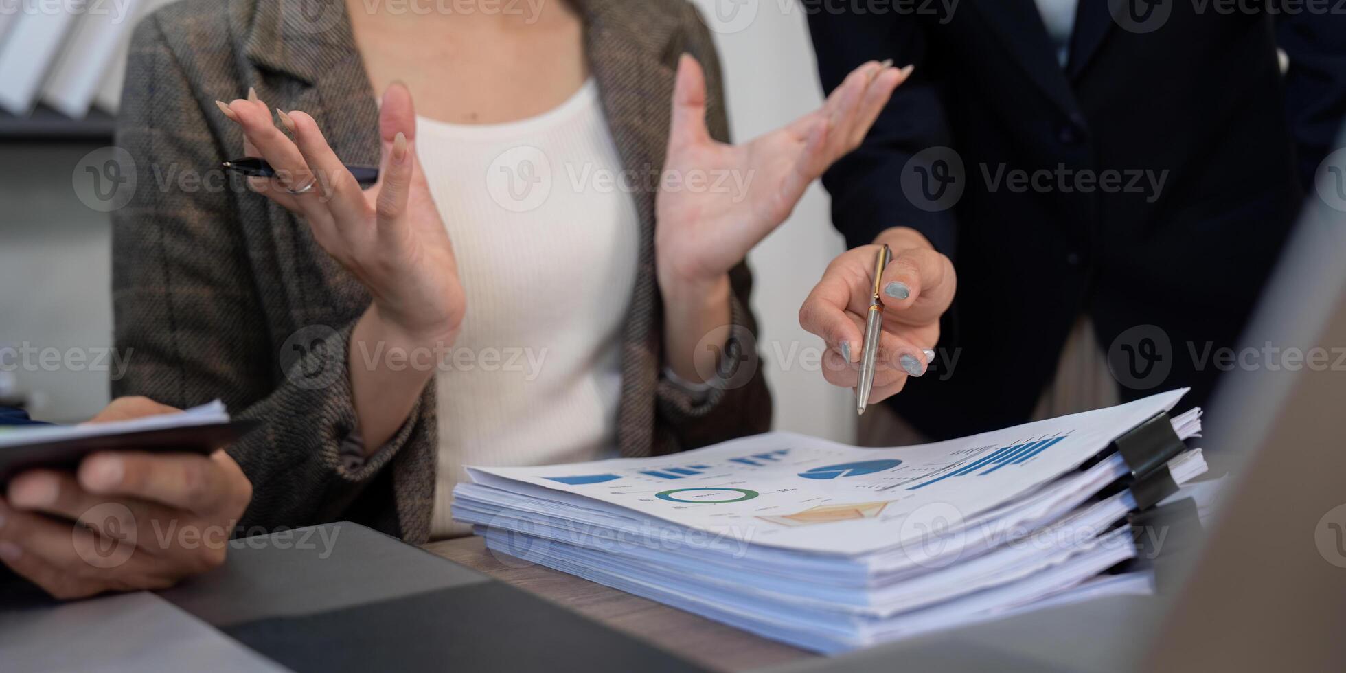 Professional Consultation and Data Analysis. A finance team analyzing key performance indicators and business trends. photo