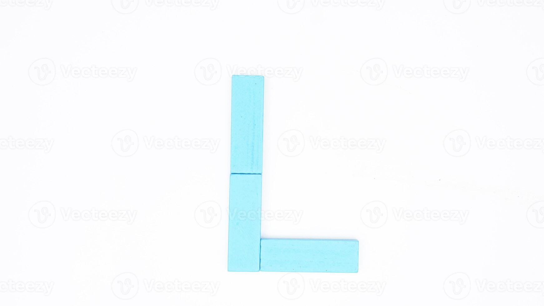 Letter L from blue color wood block isolated on white background photo