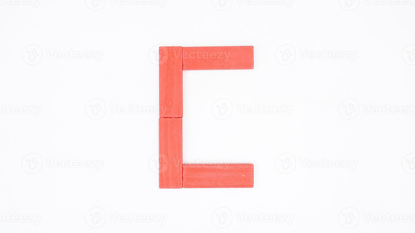 Letter C from red color wood block isolated on white background photo