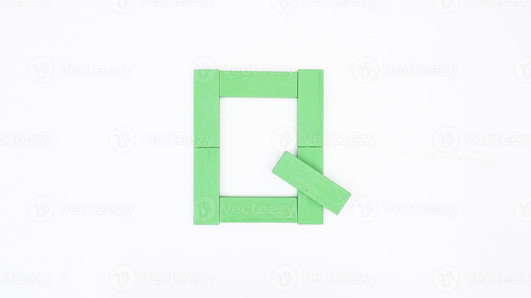 Letter Q from green color wood block isolated on white background photo