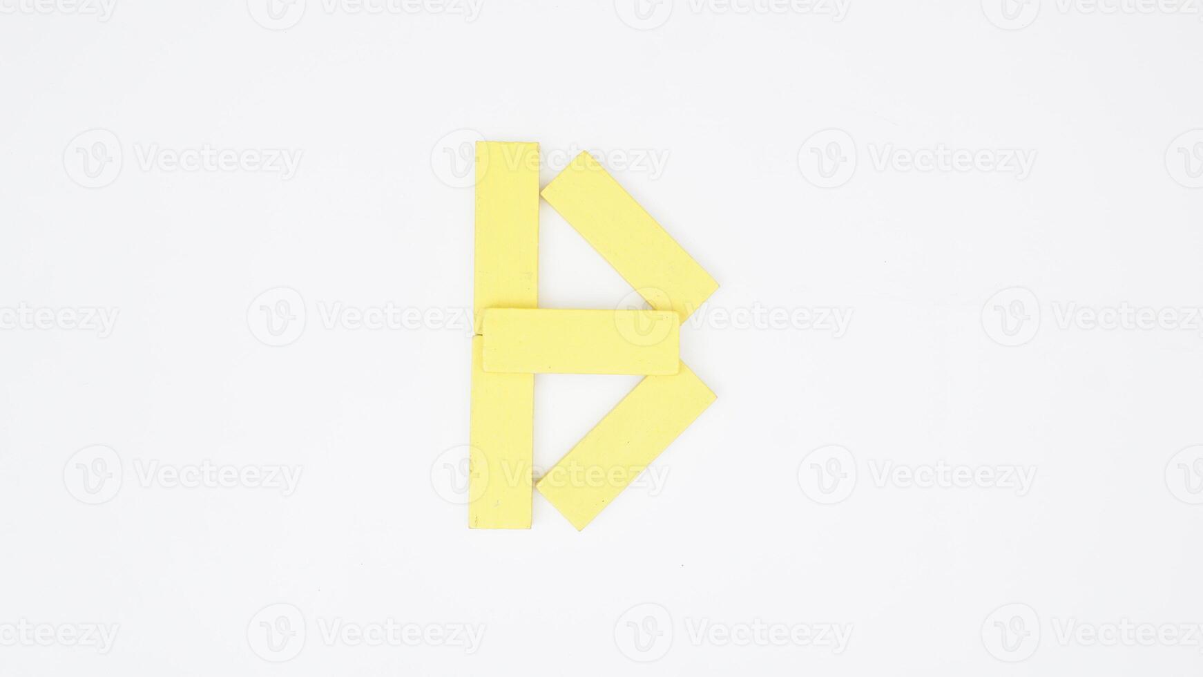Letter B from yellow color wood block isolated on white background photo