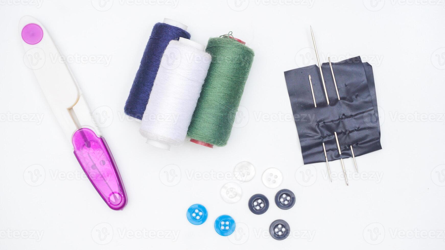 Sewing supplies and tools isolated on white background photo