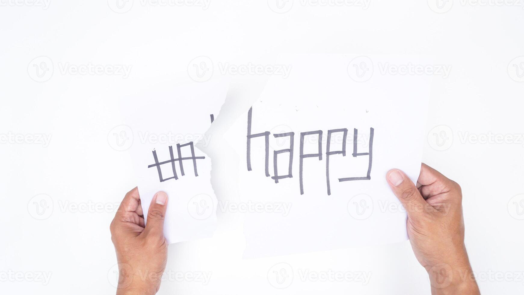 Hands tearing letters UN from word UNHAPPY to get HAPPY isolated on white background photo