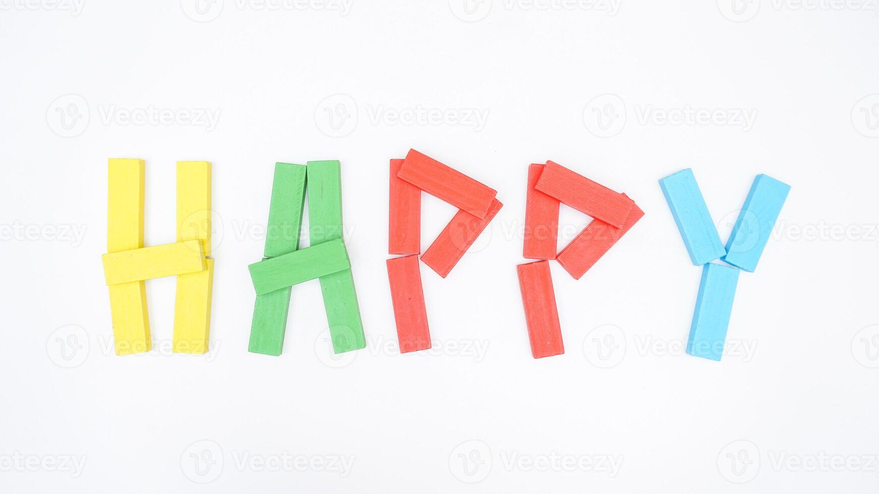 HAPPY word formed using wooden blocks of board game isolated on white background photo
