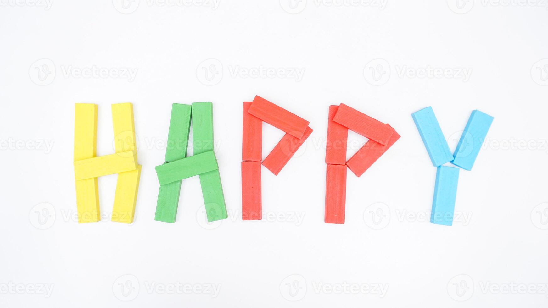 HAPPY spelled with wooden blocks of board game isolated on white background photo