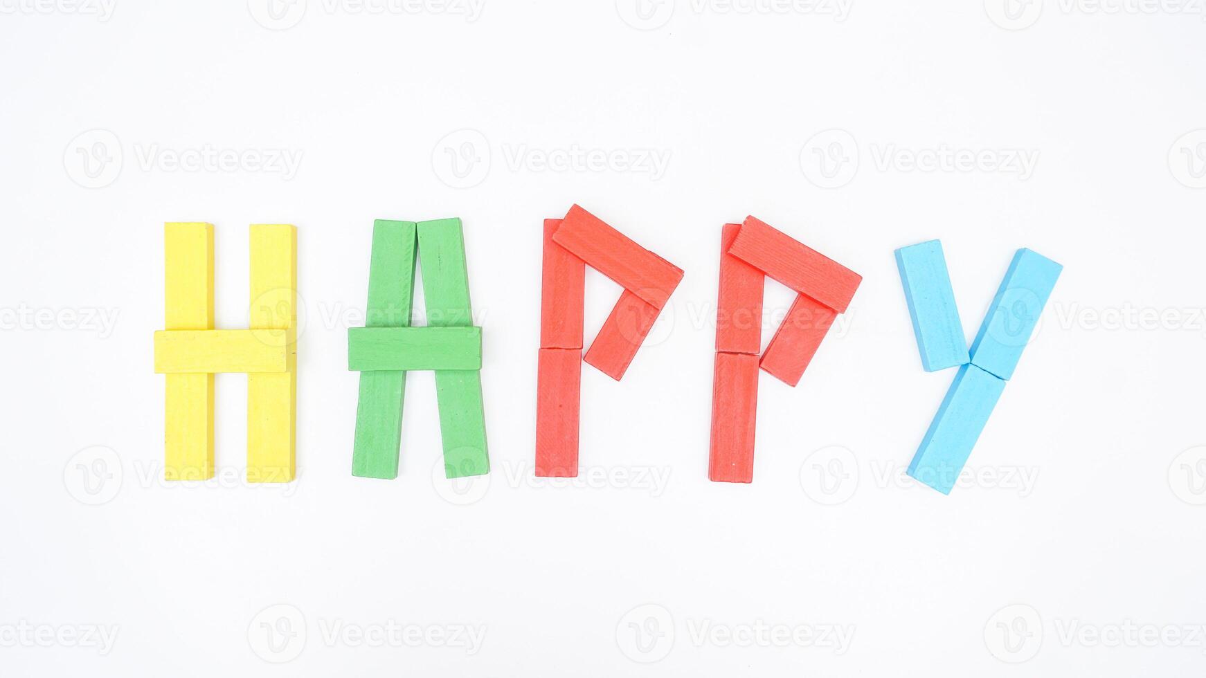 Wooden blocks of board game formed word HAPPY isolated on white background photo