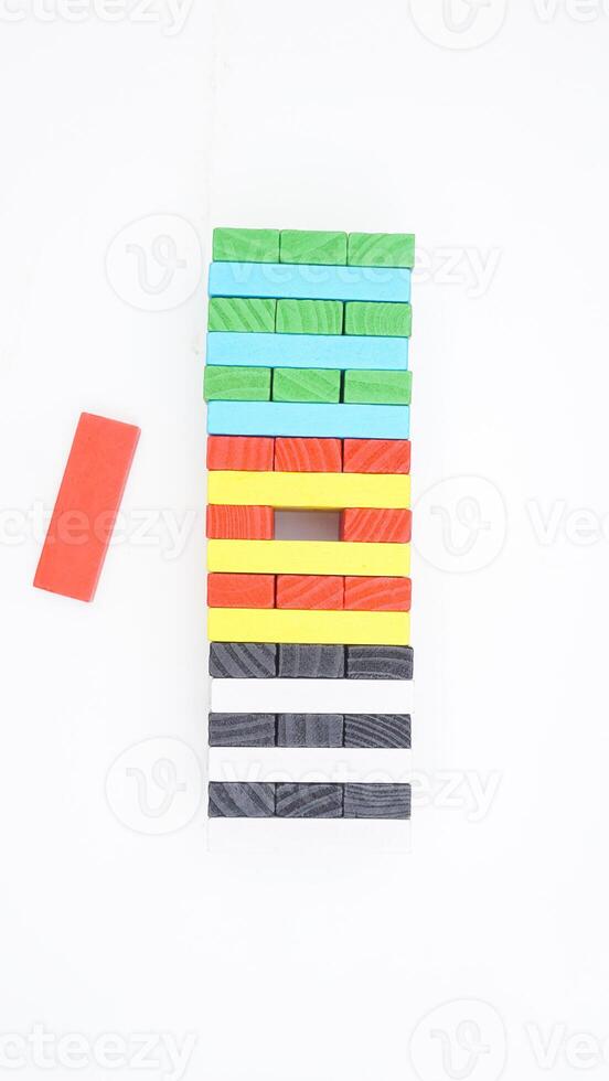 Colorful wooden blocks board game isolated on white background photo