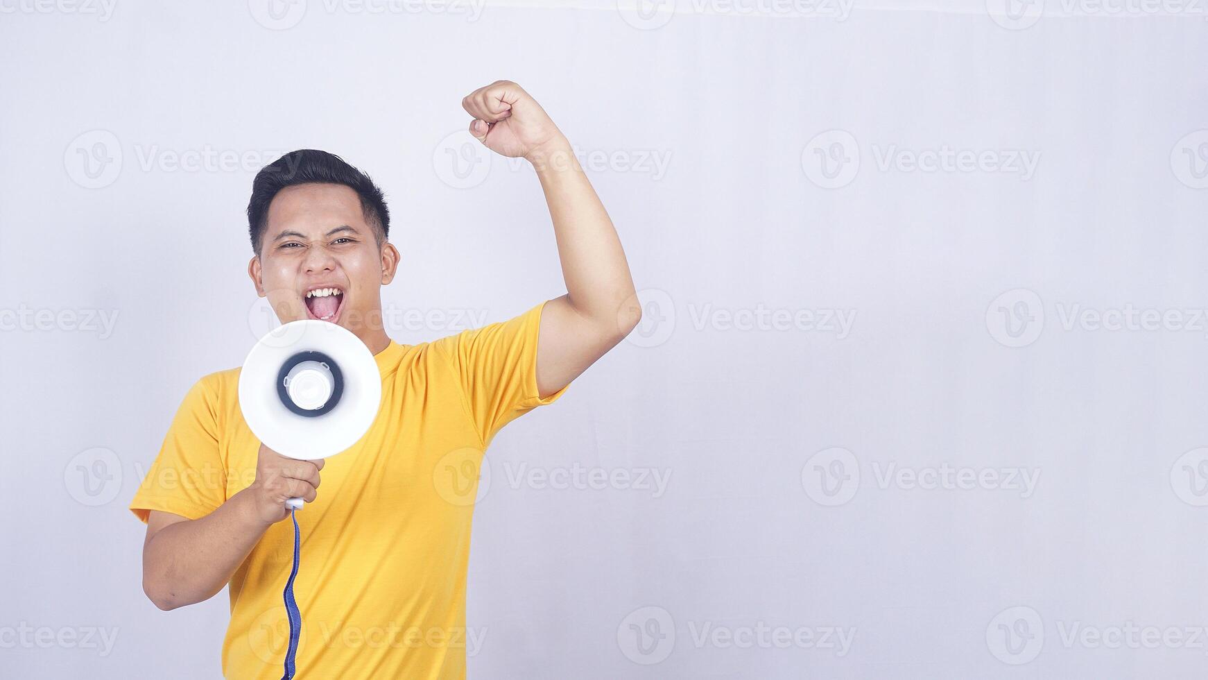 Asian man demonstrate with megaphone isolated on white background photo